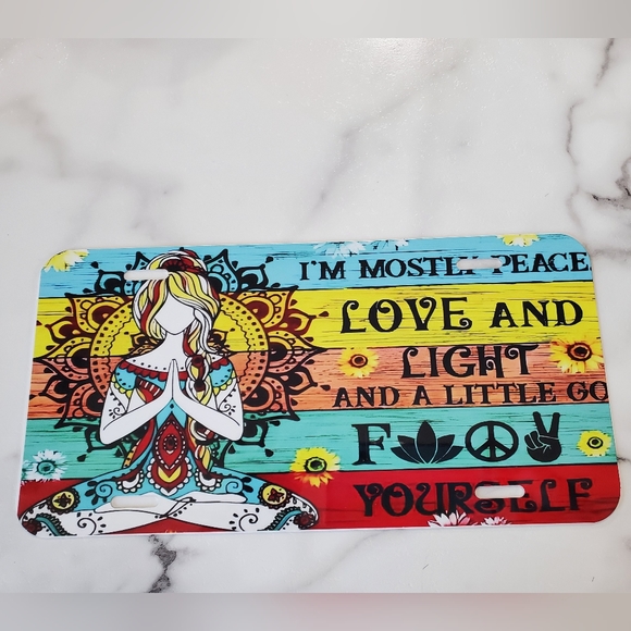 I'M MOSTLY PEACE LOVE AND LIGHT License Plate - Picture 1 of 5